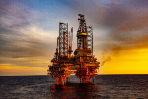 oil drilling rig at sunset